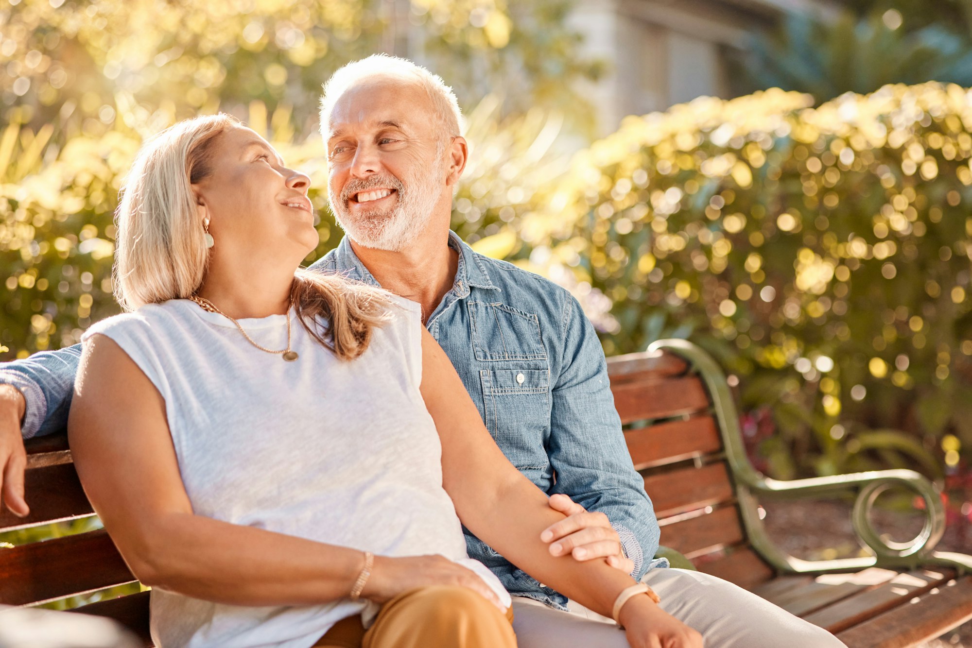 Senior date, love and couple with care in park for peace, relax and calm during retirement. Smile,